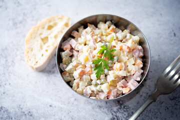 Potatoes green peas carrots sausage salad with mayonnaise
