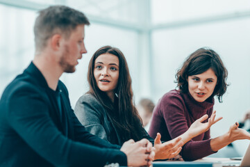 group of young business people discussing online information