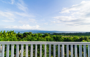 Ocean view from a white porch