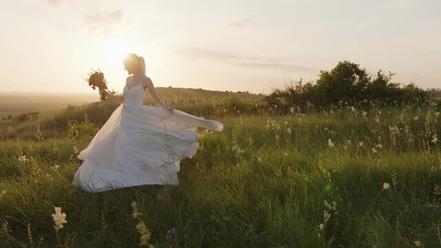 Hapy wife starts to spinning in her wedding dress