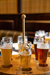 Set of craft beer in glasses. Various types of draught beer including stout, lager, ale, pilsner and weiss. Alcohol drinks in pub