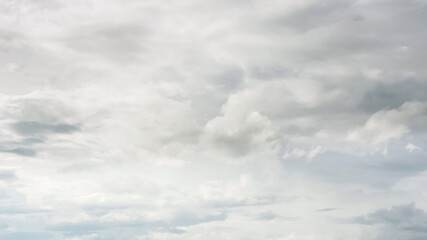 Sky with cumulus clouds illuminated by sunlight
