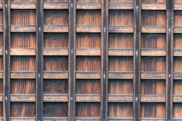 Square grid pattern in old textured wood