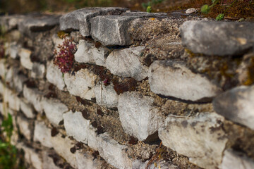 An old stone wall building. Stock Photo.