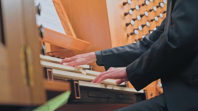 Organist plays music on church organ