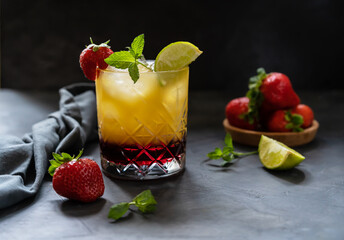 Cocktail with strawberry, lemon and orange juice