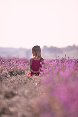 Beautiful blonde girl on lavender field