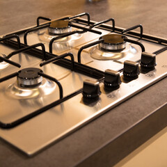 Modern clean kitchen and stainless steel built-in gas oven