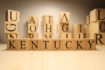 The word Kentucky was created from wooden letter cubes. Cities and words.