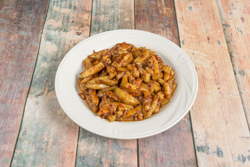 Chinese stew of chopped aubergines with spicy meat on white porcelain plate