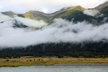 Foto op Plexiglas Mountains and scarf of clouds - Haast River, New Zealand © jerzy
