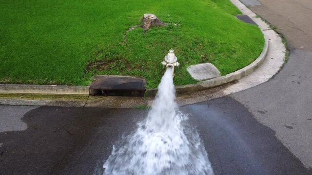Fire Hydrant spewing water onto street