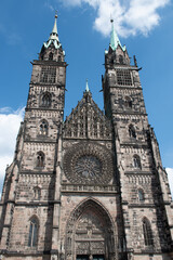 Fototapeta na wymiar West facade of the medieval Evangelical Lutheran Church of St. Lorenz (St. Lawrence) in Nuremberg, Germany