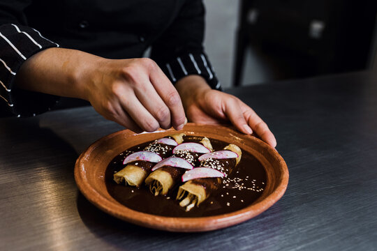 Latin Woman Chef Cooking Traditional Mexican Food In A Restaurant Kitchen In Mexico