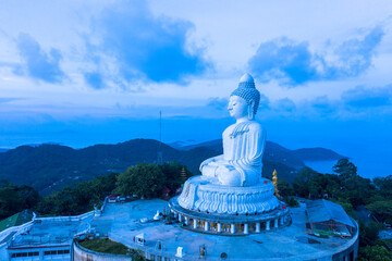 aerial view head of Phuket big Buddha in blue sunrise..Phuket Big Buddha is one of the island most important and revered landmarks on the island..image for travel and culture concept. © Narong Niemhom