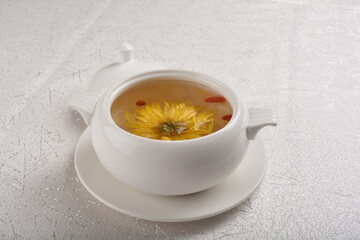 Chinese chilled hashima chrysanthemum flower and herbal sweet soup in white bowl asian healthy Halal dessert menu