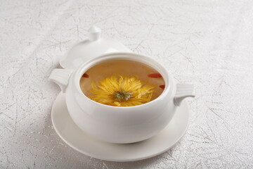 Chinese chilled hashima chrysanthemum flower and herbal sweet soup in white bowl asian healthy Halal dessert menu