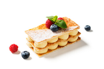 Classic french dessert millefeuille with vanilla cream and fresh berries. isolated on white...