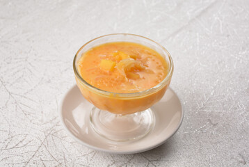 chilled sweet yellow mango fresh fruit sago puree soup with pomelo in cocktail glass asian healthy...