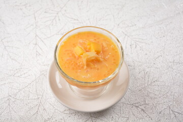 chilled sweet yellow mango fresh fruit sago puree soup with pomelo in cocktail glass asian healthy Halal dessert menu