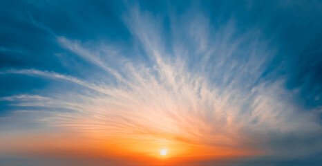 Sun rises above the clouds - a gentle fairy-tale dawn - Dawn among bright fiery clouds at high altitude. Abstract photography.