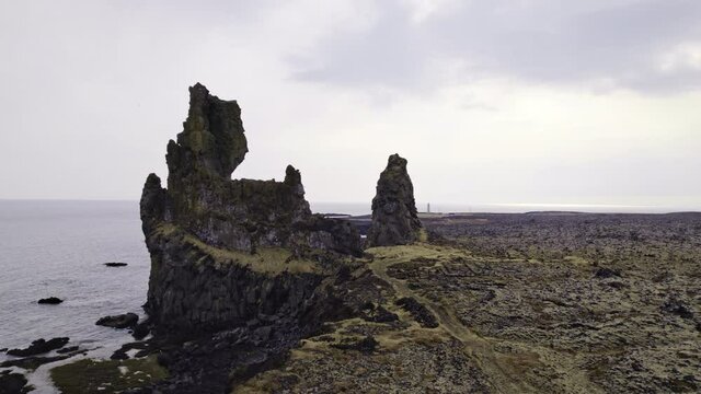 Stone Structures Surrounded by Sea Waters and Birds Flying Over, Iceland