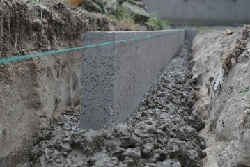 Installation Of Curbs. Laying Curb Stones Using Concrete