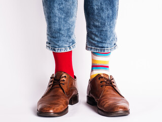 Men's legs, trendy shoes and bright socks. Close-up. Style, beauty and elegance concept