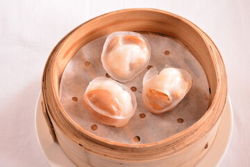 steamed crystal pork prawn meat dumpling with whole mini abalone in bamboo basket Hong Kong dim sum menu