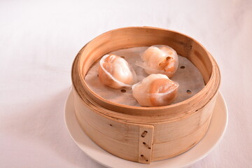 steamed crystal pork prawn meat dumpling with whole mini abalone in bamboo basket Hong Kong dim sum menu