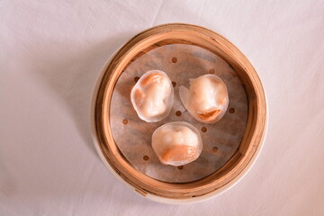 steamed crystal pork prawn meat dumpling with whole mini abalone in bamboo basket Hong Kong dim sum menu