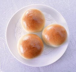 baked sweet char siew pork meat bun bread in golden skin colour pastry dim sum menu