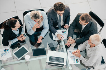 business team discussing financial issues at a working meeting.