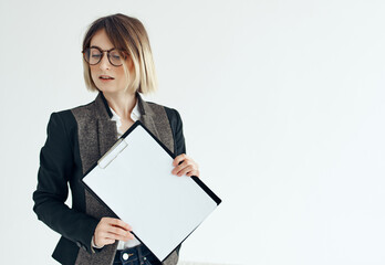 Business woman wearing glasses documents office professional light background
