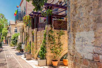 Colorful streets with bougainvillea flowers and plants in the Nahlaot neighborhood in Jerusalem