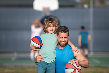 Dad and his son playing basketball. Father and son enjoying sport basketball outdoor. Childhood and...
