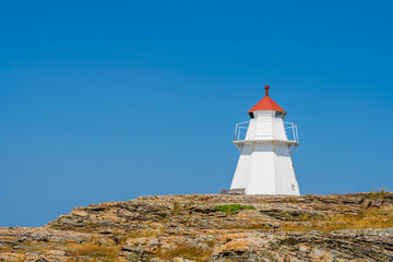 Fototapeta na wymiar Krogsta lighthouse is built 1928 and located in Bua on the Swedish west coast.