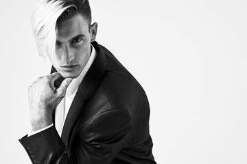 Fototapeta na wymiar in a black blazer suit self confidence fashion studio