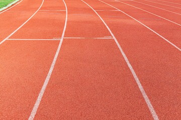 The curved lane in running track or athlete track in stadium. Running track is a rubberized artificial running surface for track and field athletics