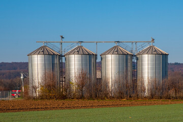 silver shining silos at the field