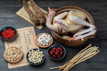 Fresh hens and Chinese herbs on the table.