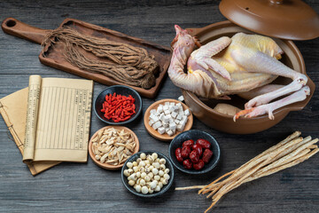 Fresh hens and Chinese herbs on the table.