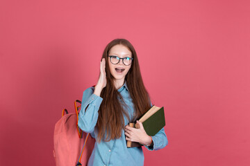 Little kid girl 13 years old isolated on pink background schoolgirl with backpack and books happy love studying education concept