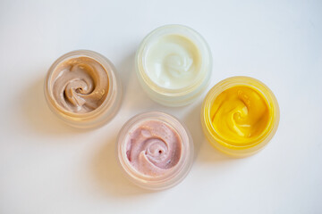 Cream in a jar on a white background