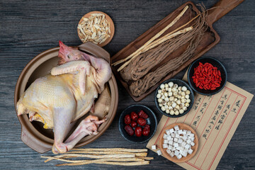 Fresh hens and Chinese herbs on the table.