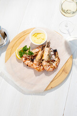 grilled prawns with a glass of white wine