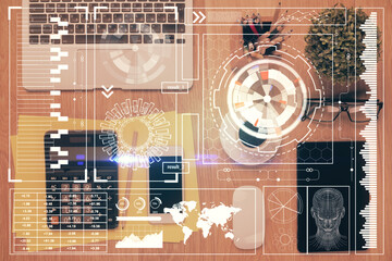 Double exposure of technology theme drawing over work table desktop. Top view. Global data analysis concept.