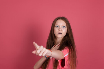 13 years old girl kid in casual isolated on terracotta background  scared shocked point finger