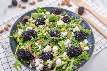 healthy summer salad with berries and feta cheese