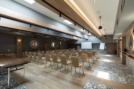 Interior of a conference room with golden chairs